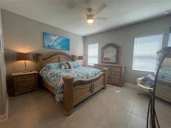 a bedroom with a bed and a couch