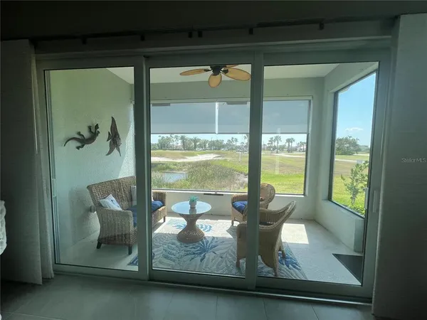 a balcony with furniture and window