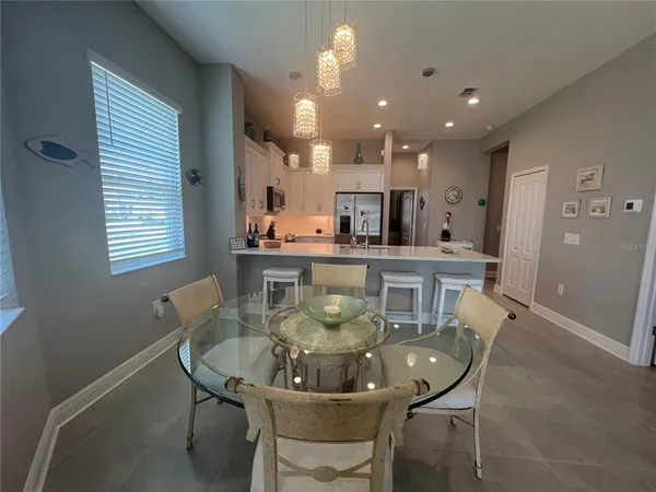 a view of a dining room with furniture and window