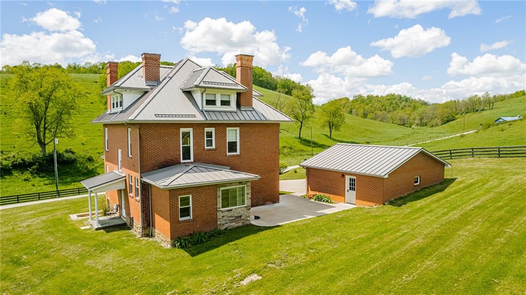 474 Scott Run Road Sycamore, PA 15364 - Photo 5 of 25 an aerial view of a house with table and chairs