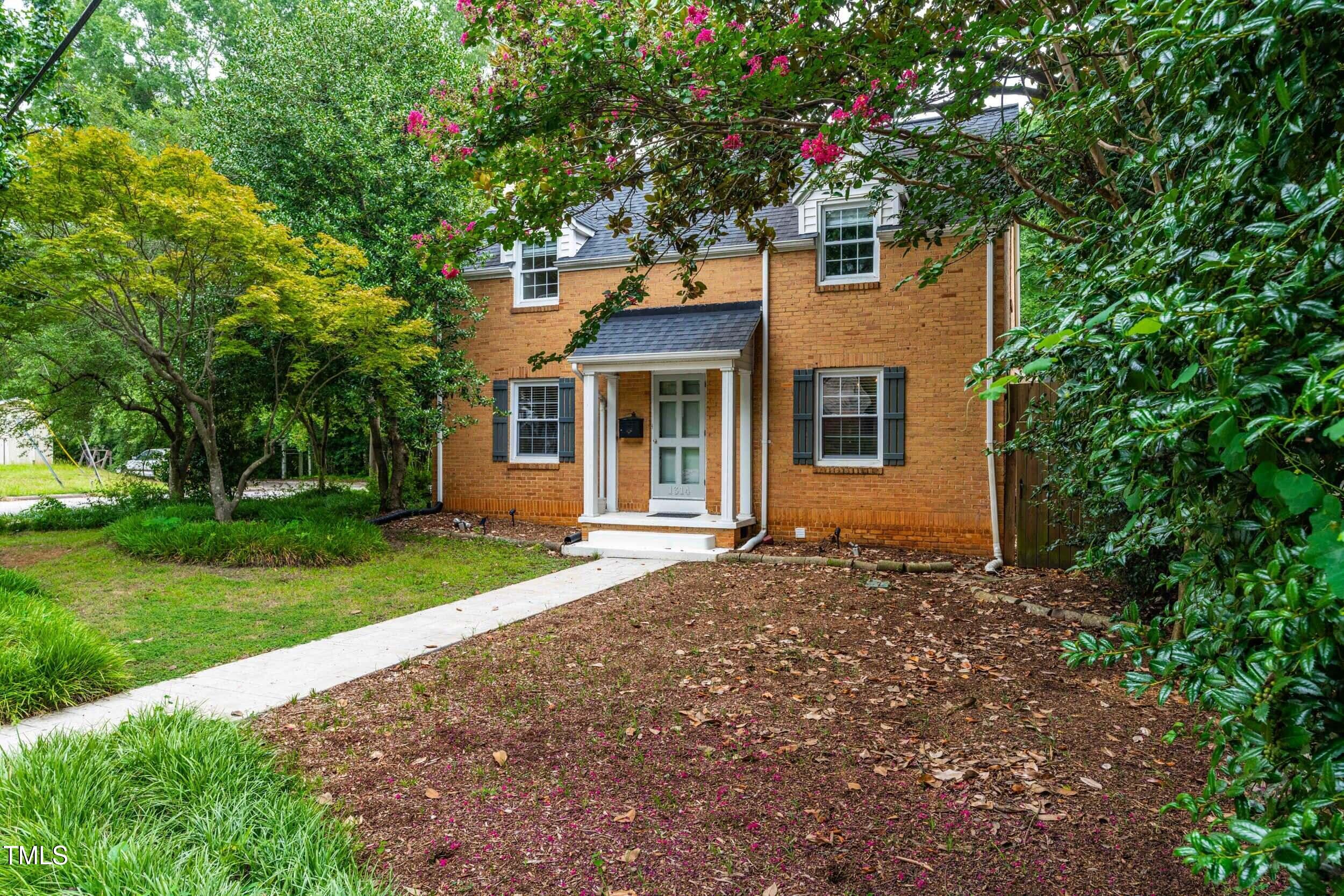 1314 Wake Forest Road Raleigh, NC 27604 - Photo 1 of 32 front view of a house with a yard