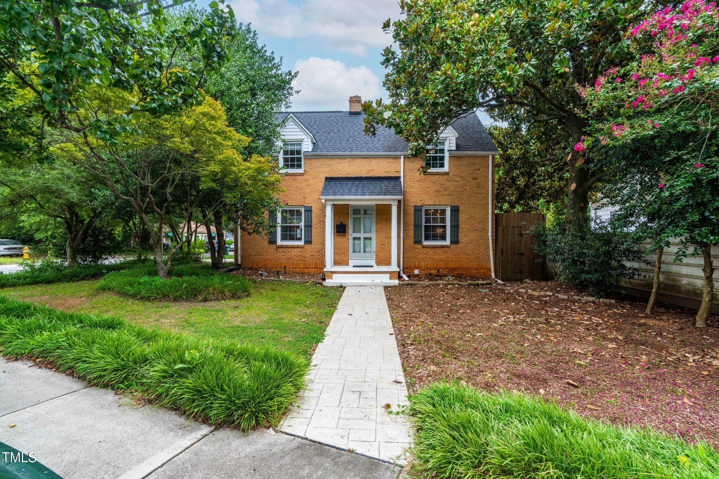 1314 Wake Forest Road Raleigh, NC 27604 - Photo 11 of 32 front view of a house with a yard