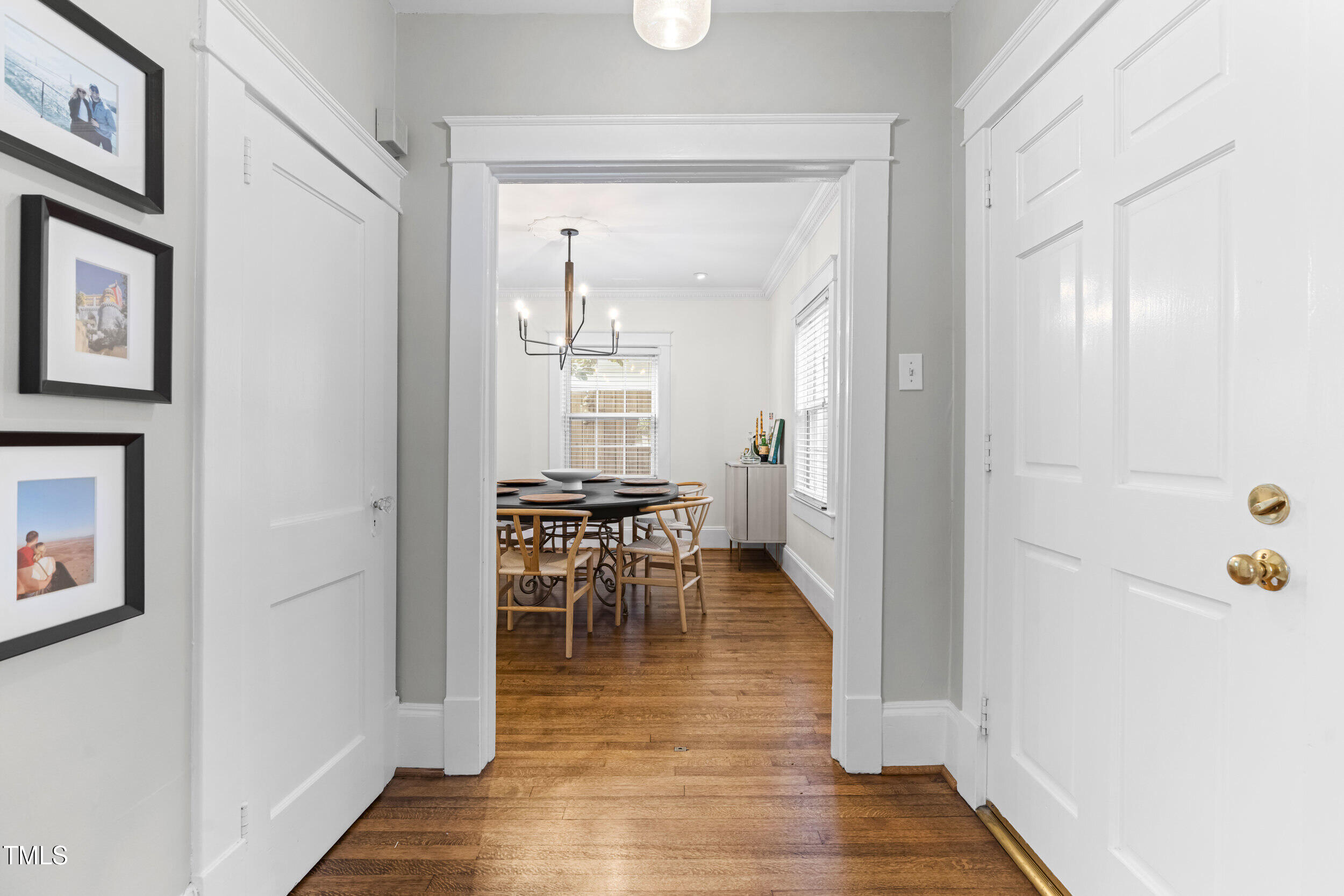 1314 Wake Forest Road Raleigh, NC 27604 - Photo 12 of 32 a view of a hallway with wooden floor and furniture
