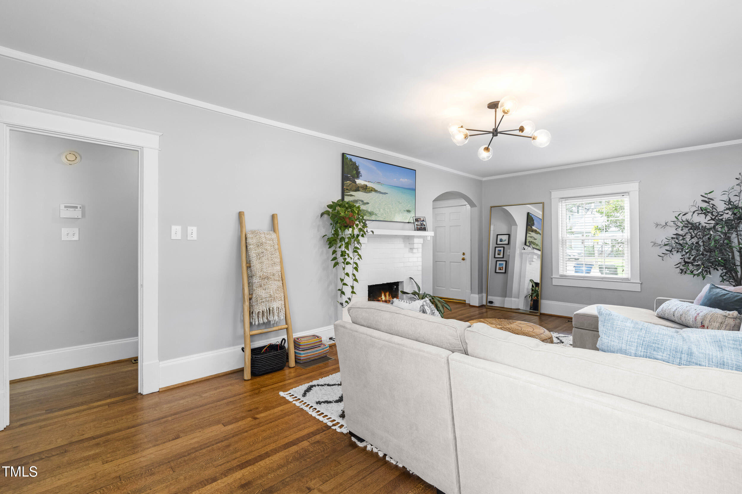 1314 Wake Forest Road Raleigh, NC 27604 - Photo 13 of 32 a living room with furniture and wooden floor