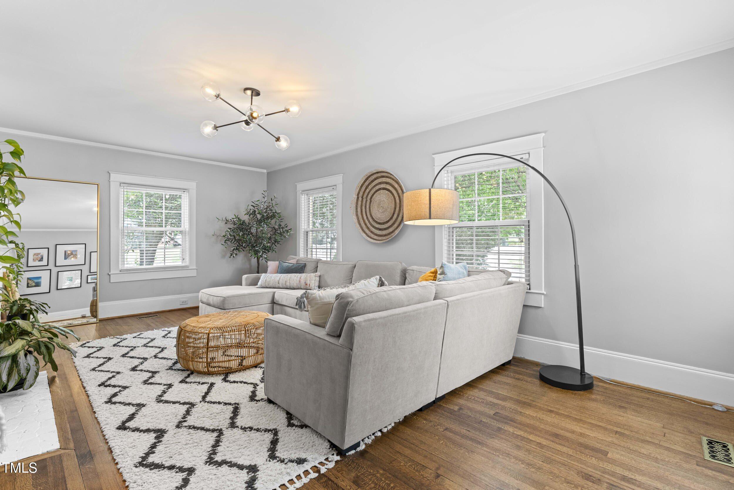 1314 Wake Forest Road Raleigh, NC 27604 - Photo 14 of 32 a living room with furniture a table and decor