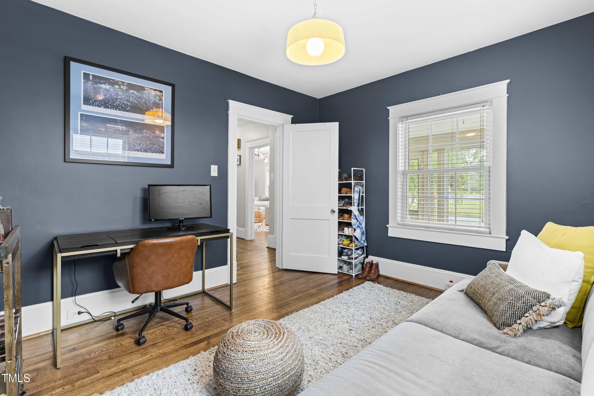 1314 Wake Forest Road Raleigh, NC 27604 - Photo 19 of 32 a living room with furniture and a window