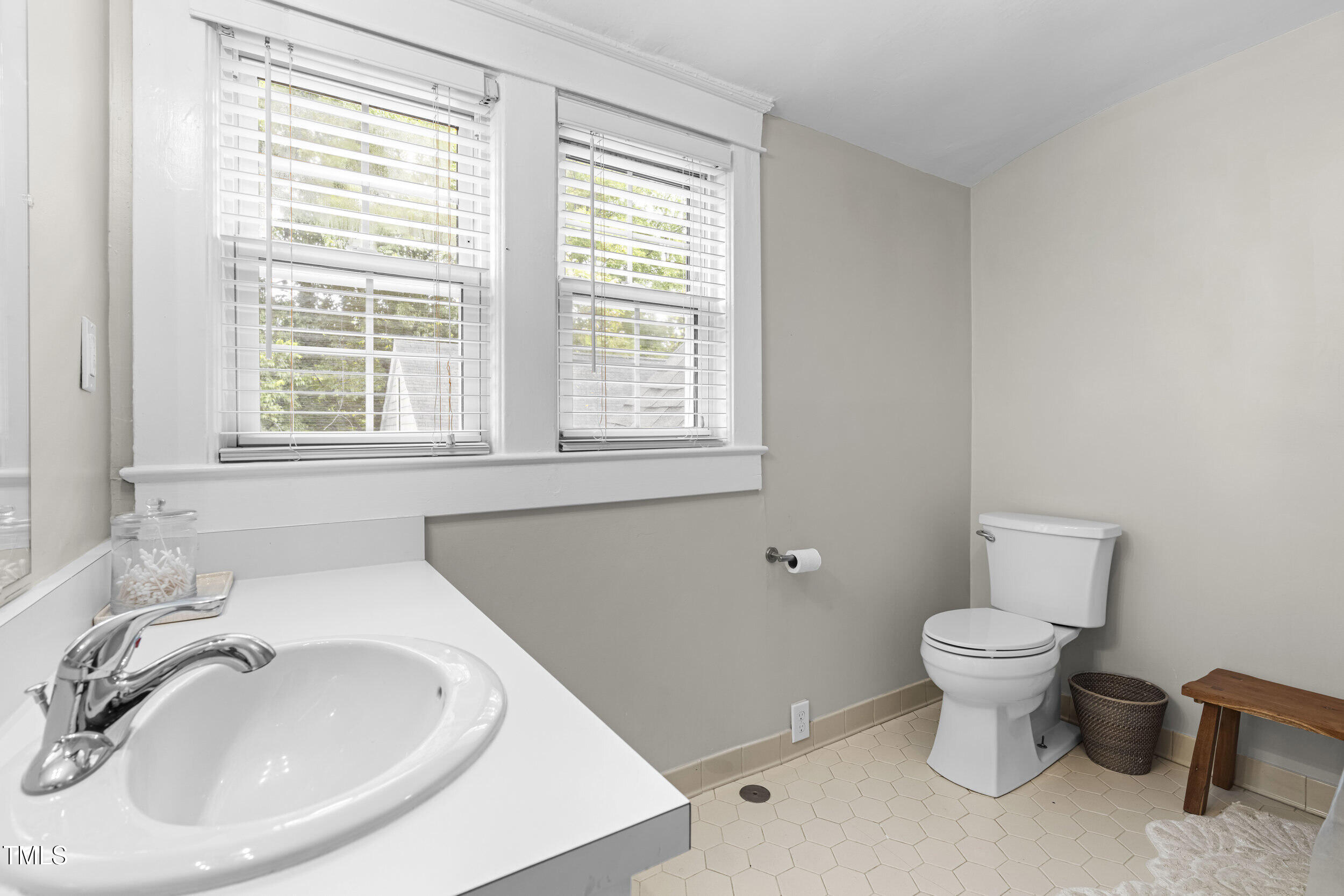 1314 Wake Forest Road Raleigh, NC 27604 - Photo 27 of 32 a bathroom with a sink and a toilet