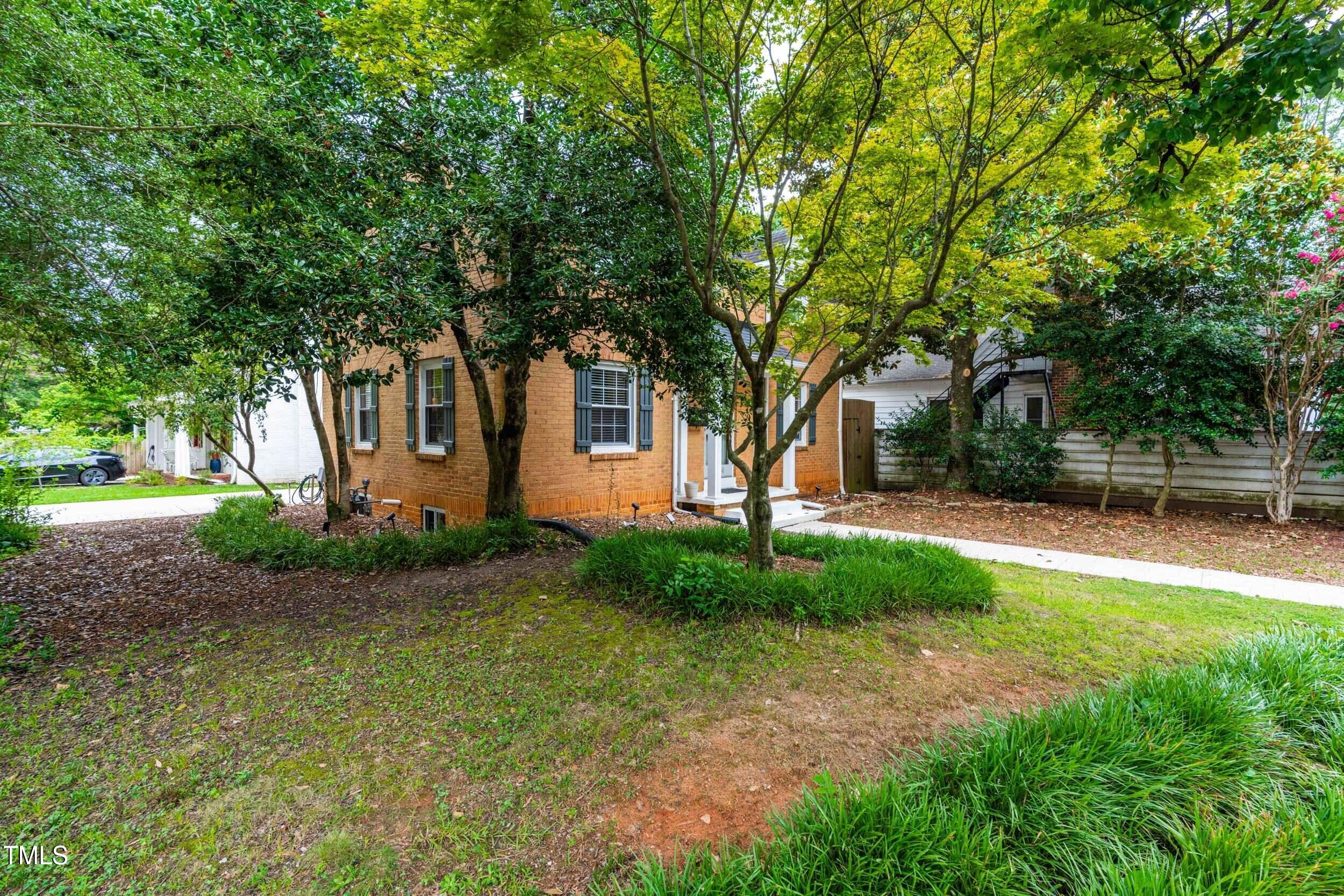 1314 Wake Forest Road Raleigh, NC 27604 - Photo 30 of 32 a view of a house with backyard and garden