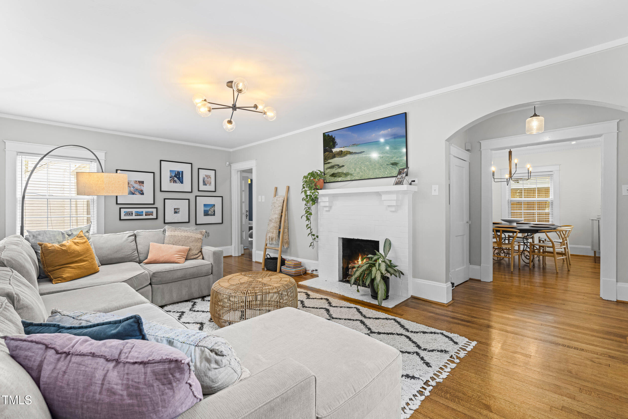 1314 Wake Forest Road Raleigh, NC 27604 - Photo 3 of 32 a living room with furniture and a fireplace