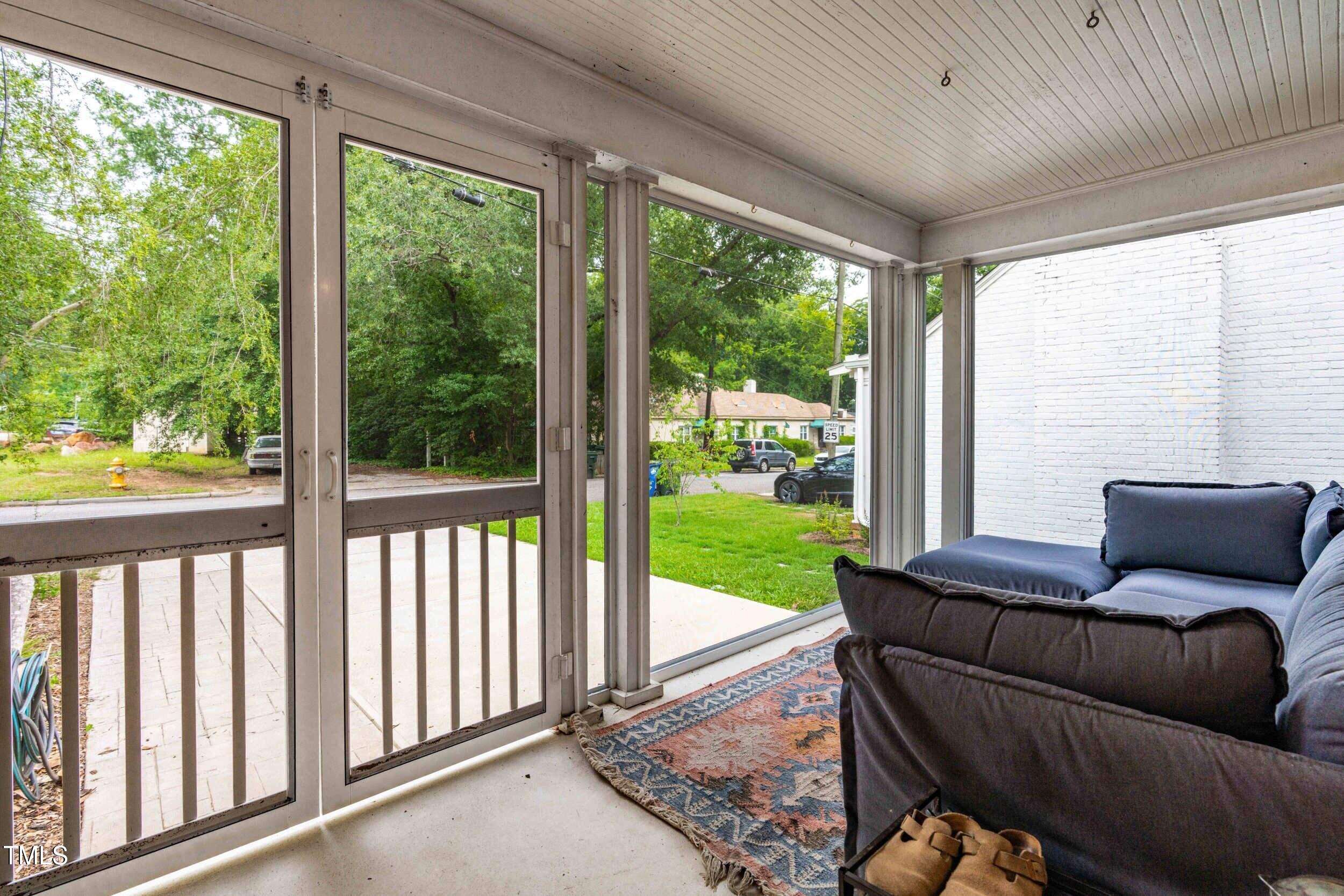 1314 Wake Forest Road Raleigh, NC 27604 - Photo 31 of 32 a living room with furniture and a floor to ceiling window