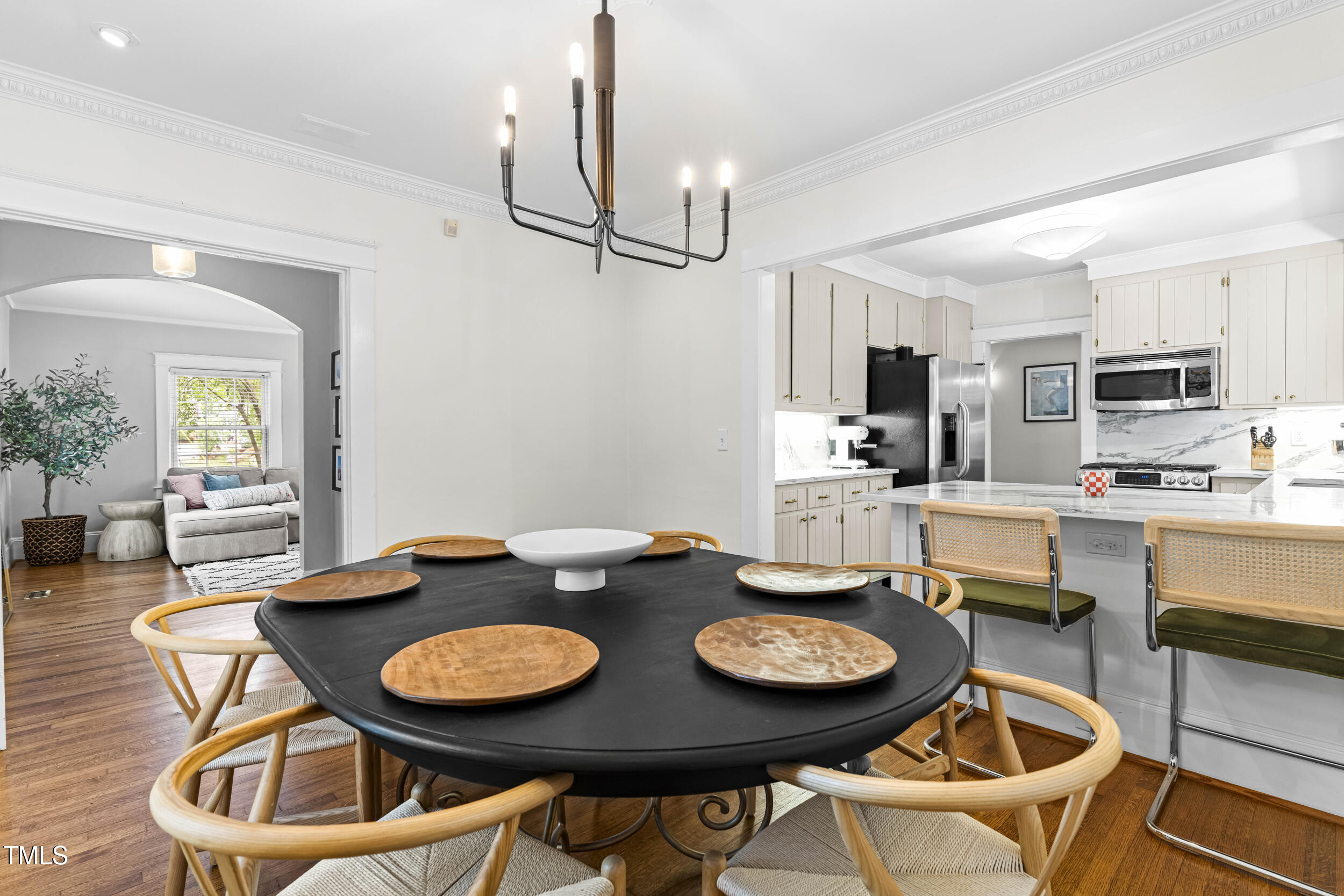 1314 Wake Forest Road Raleigh, NC 27604 - Photo 5 of 32 a view of a dining room with furniture and a kitchen view