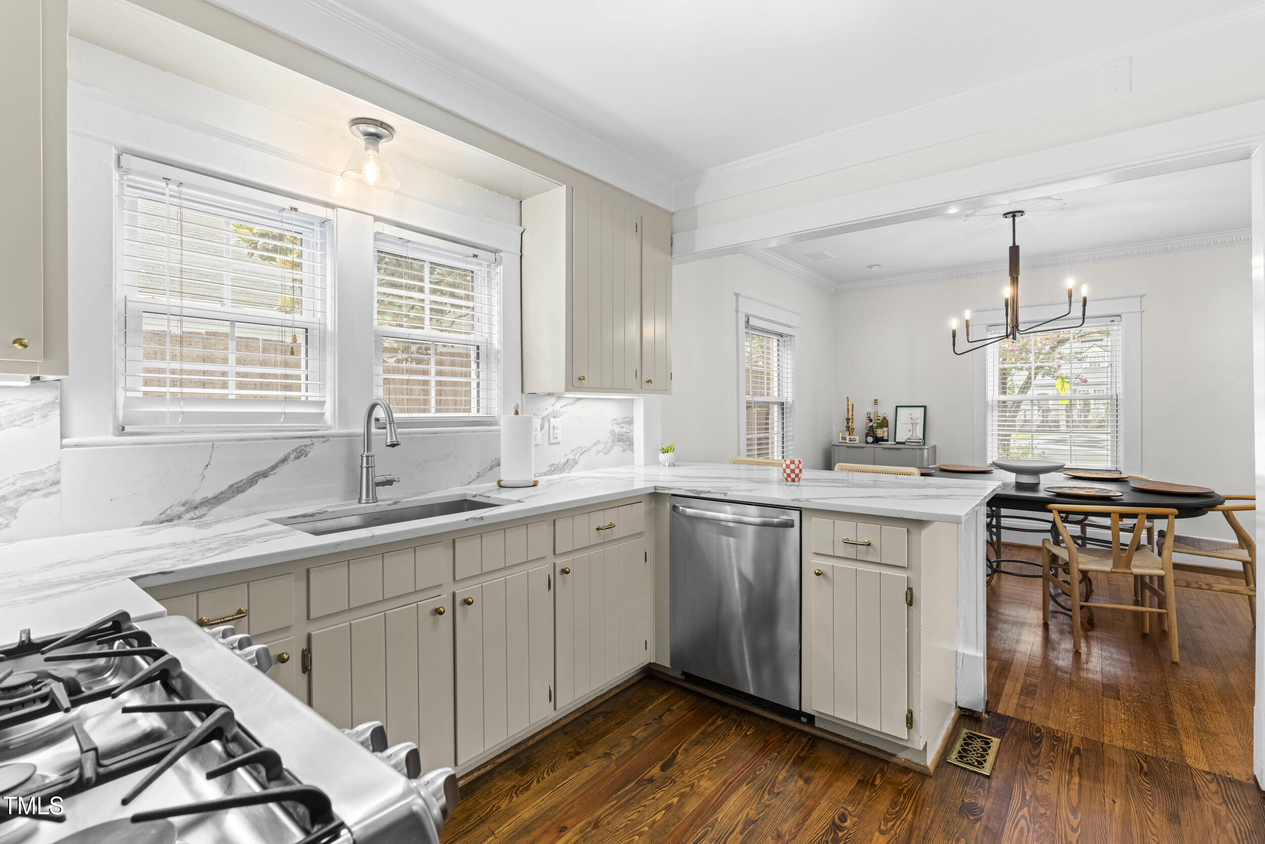 1314 Wake Forest Road Raleigh, NC 27604 - Photo 6 of 32 a kitchen with a sink stove and wooden floor