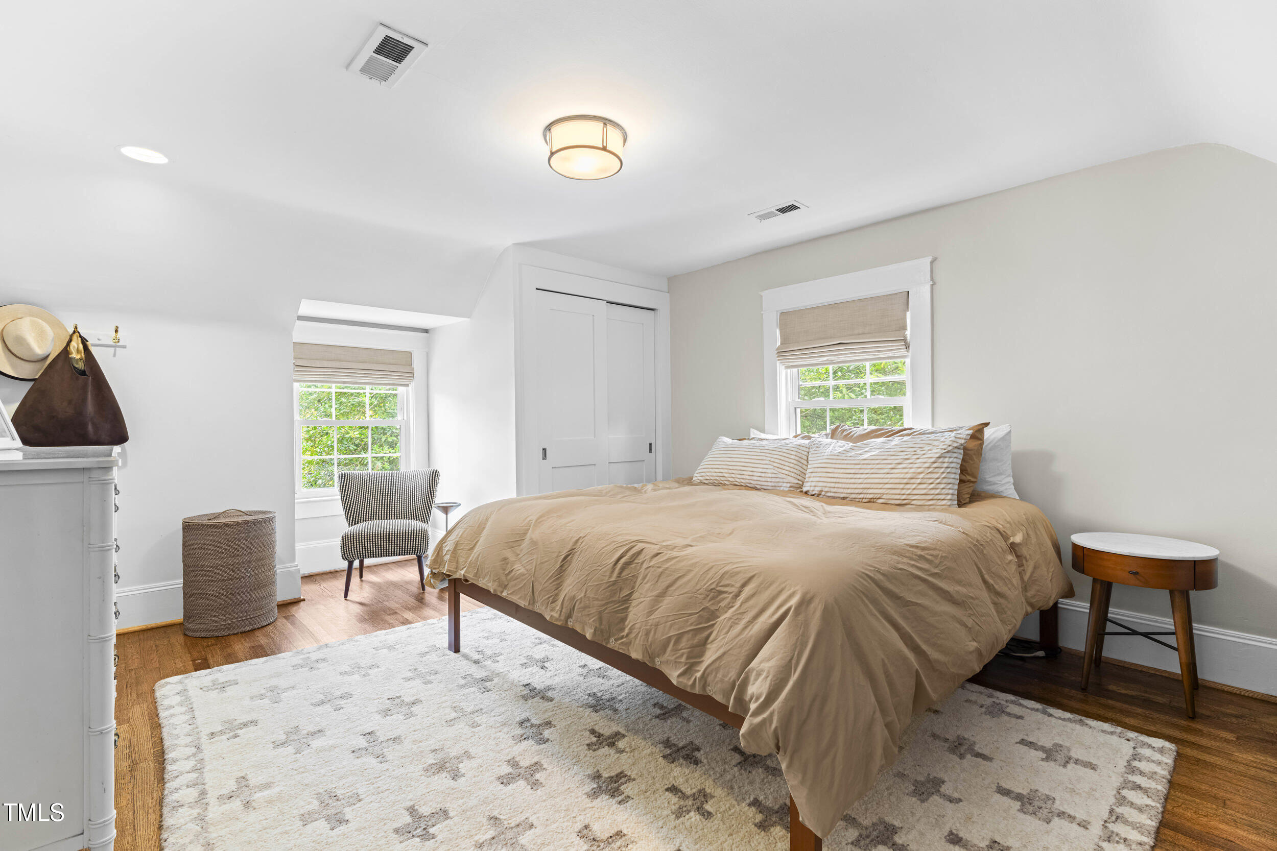 1314 Wake Forest Road Raleigh, NC 27604 - Photo 7 of 32 a bedroom with a bed and wooden floor