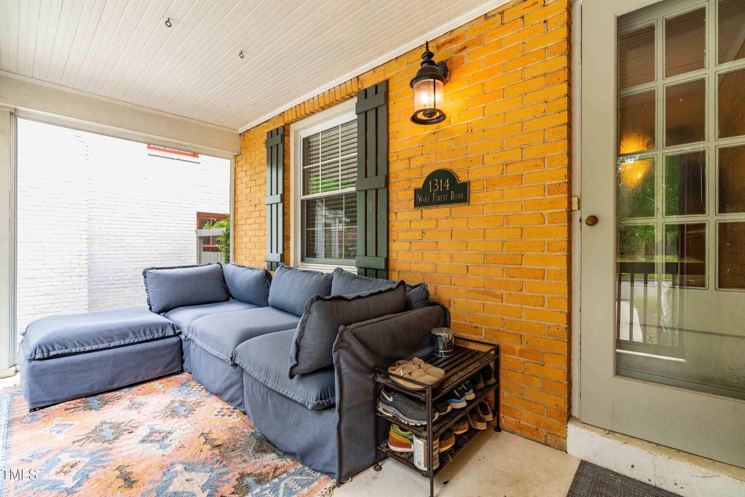 1314 Wake Forest Road Raleigh, NC 27604 - Photo 9 of 32 a living room with furniture and windows