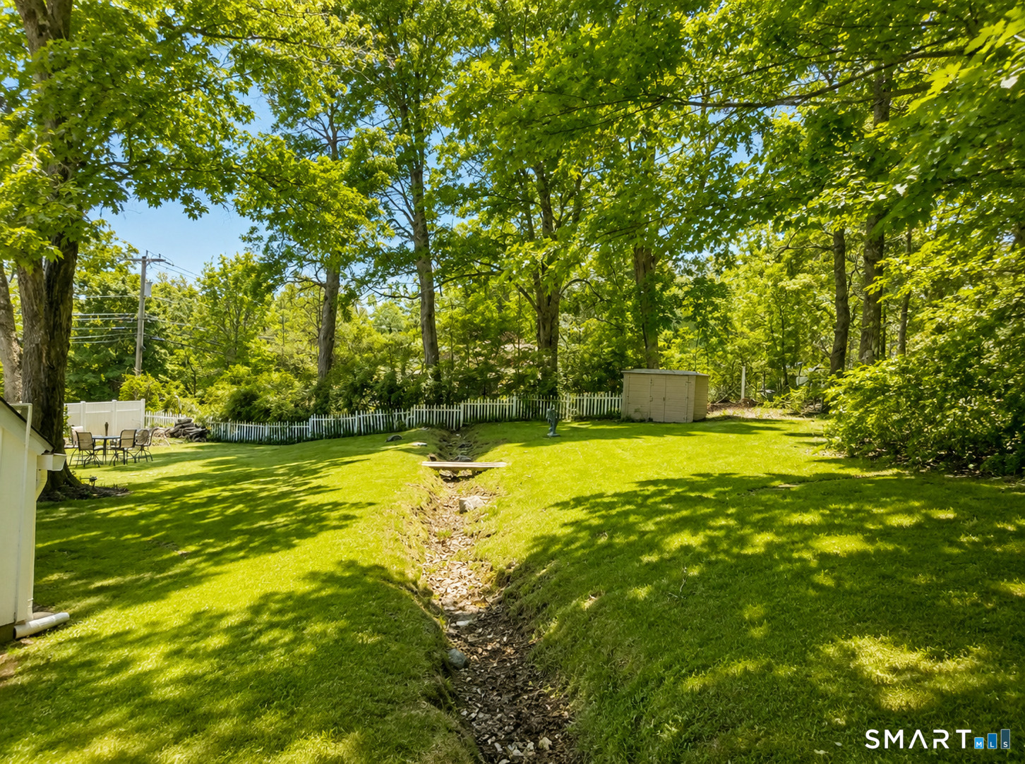 443 Amity Road Bethany, CT 06524 - Photo 7 of 30 a view of a swimming pool with an outdoor space and seating area