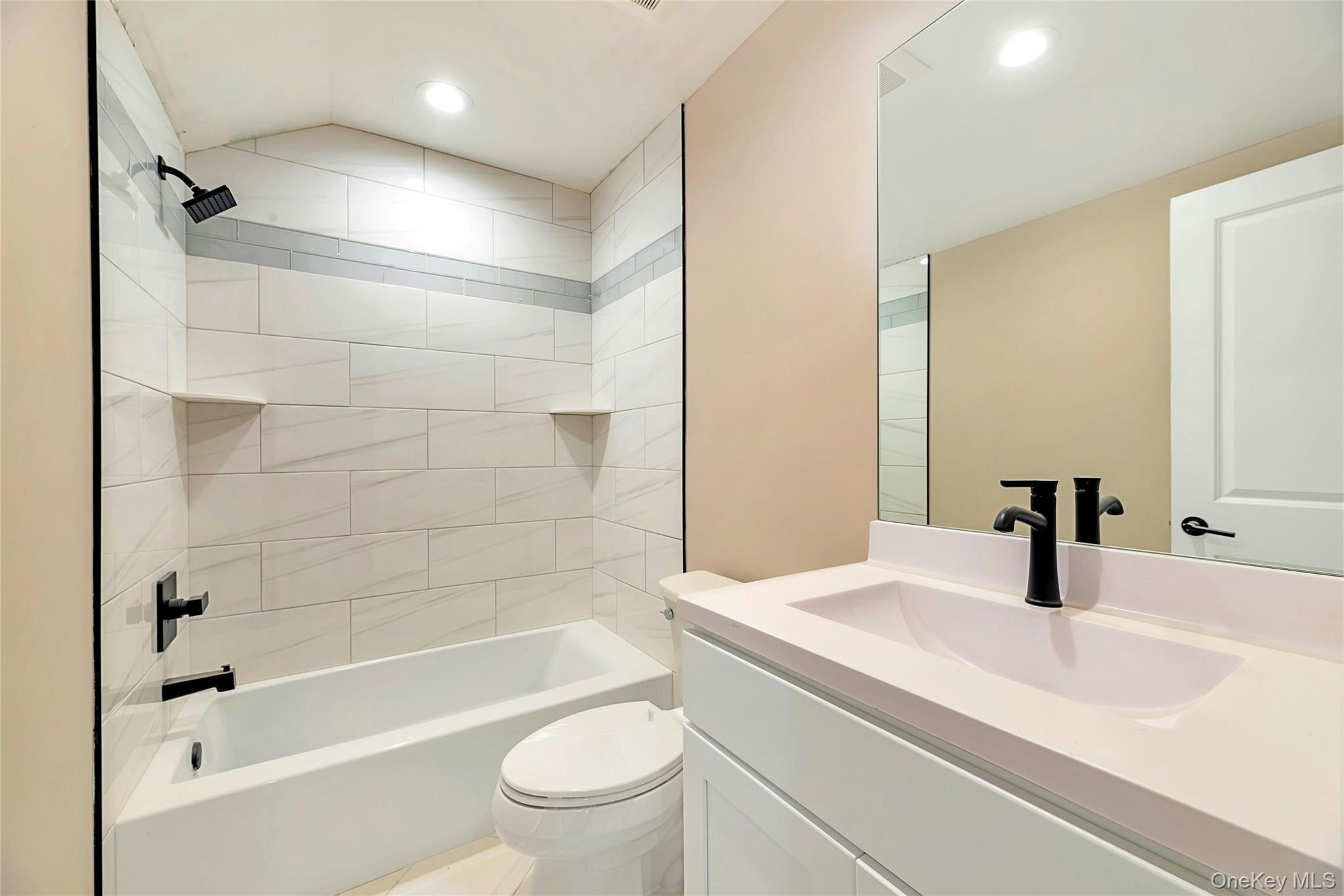 487 Neighborhood Road Shirley, NY 11967 - Photo 9 of 18 Full bath with washtub / shower combination, vanity, and recessed lighting