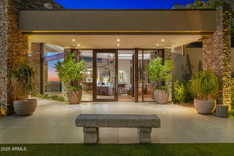 a kitchen with stainless steel appliances granite countertop a lot of cabinets and wooden floor
