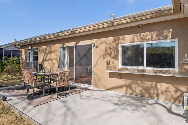 a view of a house with chairs in patio