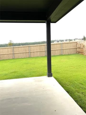 a view of a field with a big yard