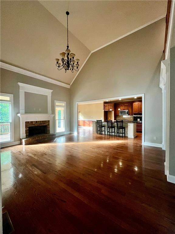 348 Hidden Trail Pendergrass, GA 30567 - Photo 21 of 40 a view of empty room with fireplace and wooden floor