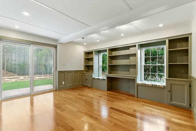 a room with a bed and a large window