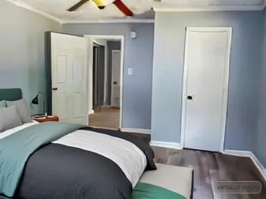 a bedroom with a bed and a dresser