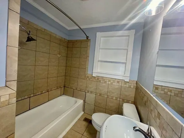 a bathroom with a sink and bathtub