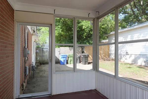 a view of a living room and a floor to ceiling window