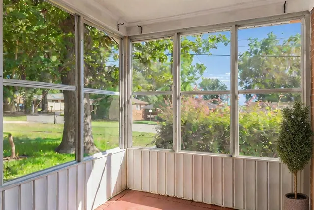 a view of a yard with a trees from a garden