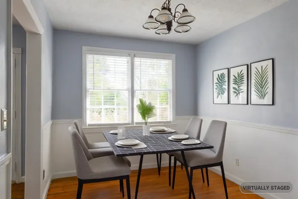 a view of a dining room with furniture window and outside view