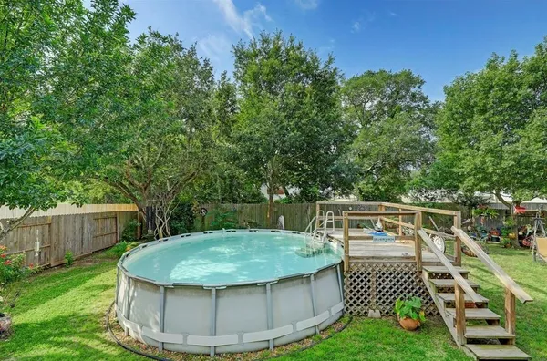 a view of a swimming pool with a patio