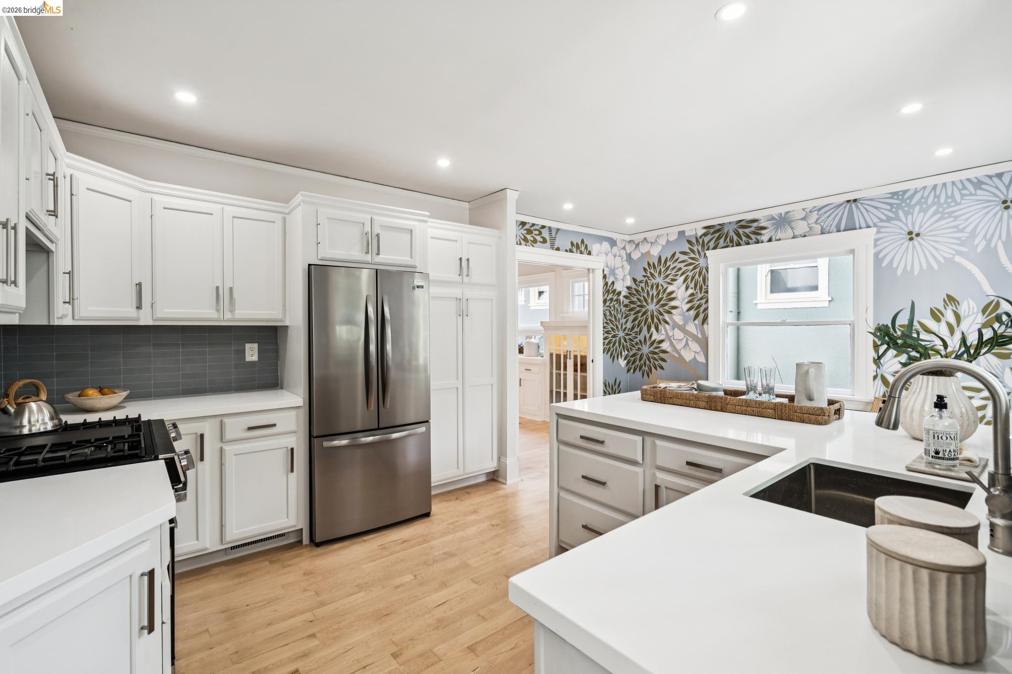 1121 Ranleigh Way Piedmont, CA 94610 - Photo 16 of 50 a kitchen with stainless steel appliances a sink a stove a refrigerator cabinets and a counter top space