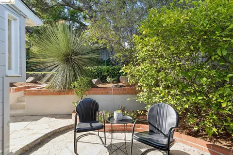 a view of balcony with wooden floor and outdoor seating