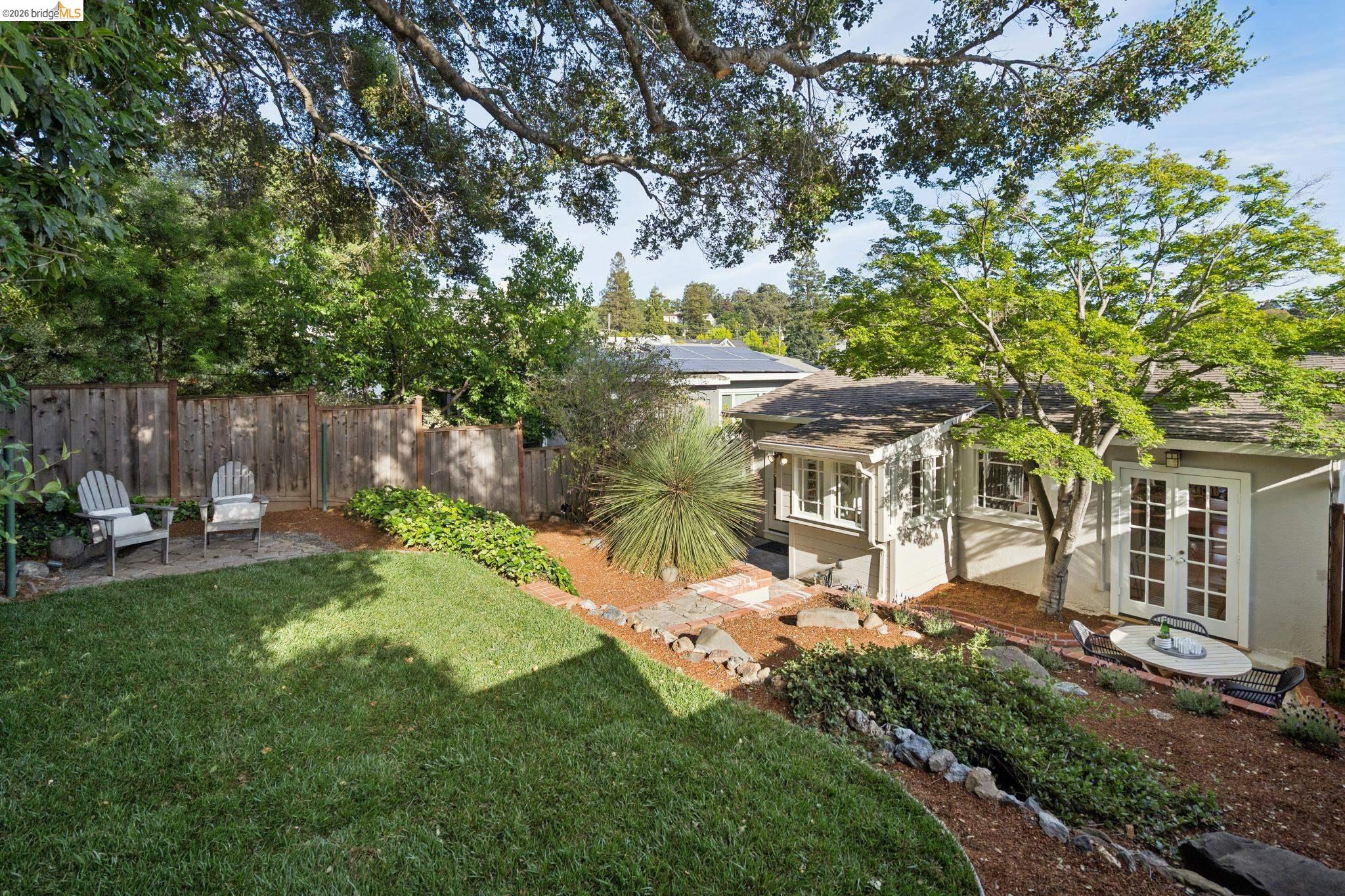 1121 Ranleigh Way Piedmont, CA 94610 - Photo 2 of 50 a view of a house with backyard and a sitting area
