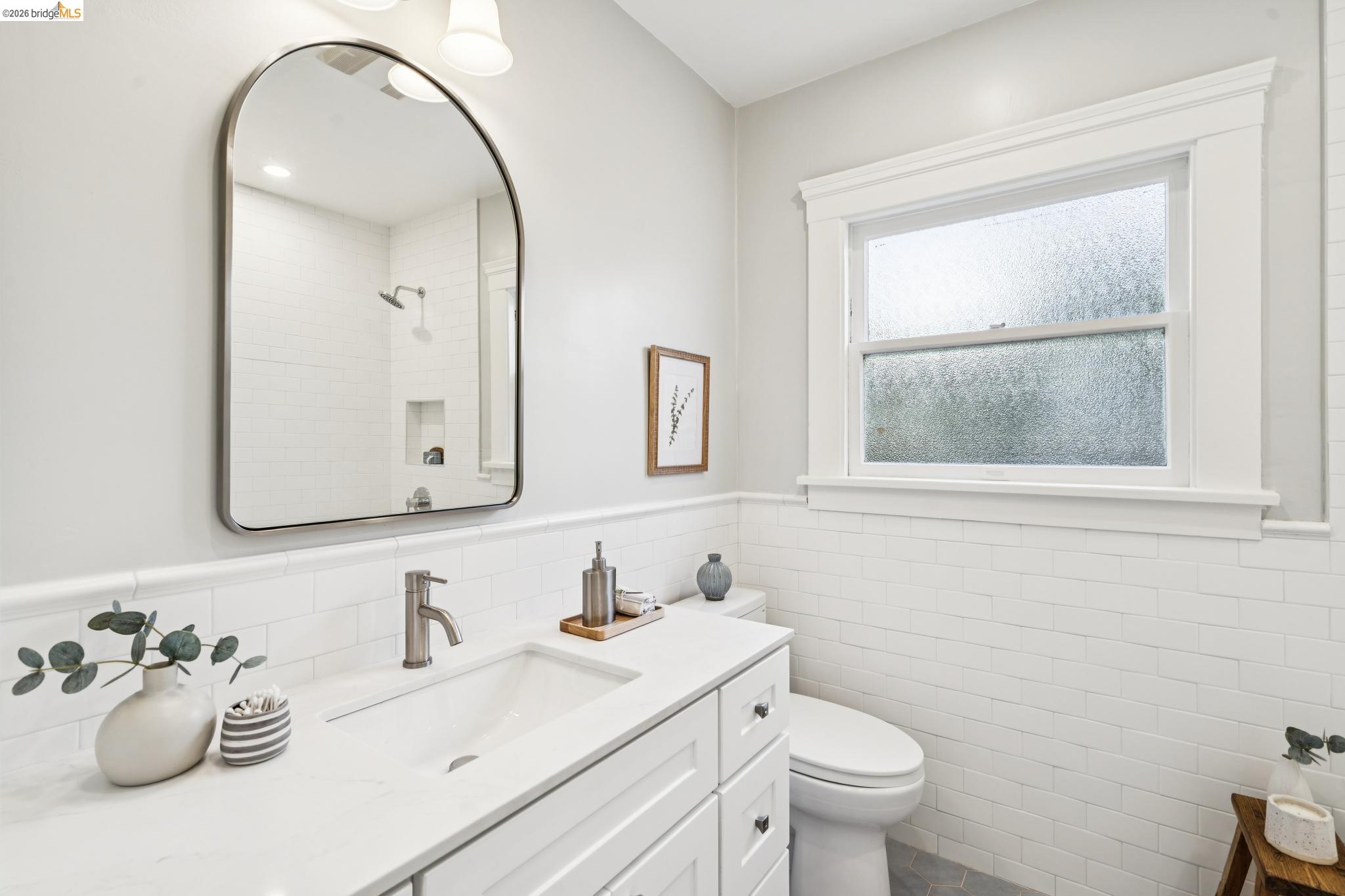 1121 Ranleigh Way Piedmont, CA 94610 - Photo 23 of 50 a bathroom with a toilet sink mirror and vanity