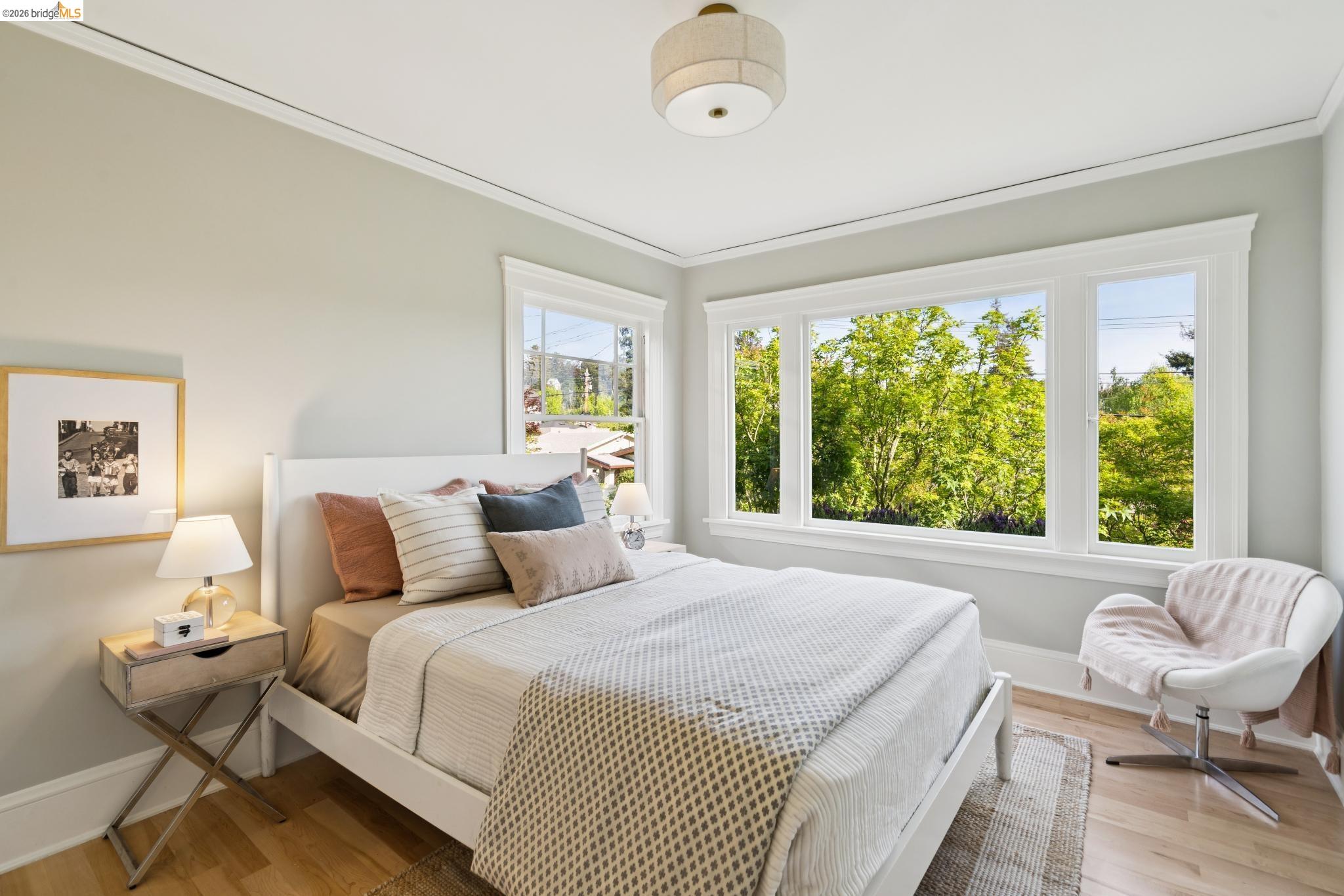 1121 Ranleigh Way Piedmont, CA 94610 - Photo 25 of 50 a bedroom with a bed and wooden floor