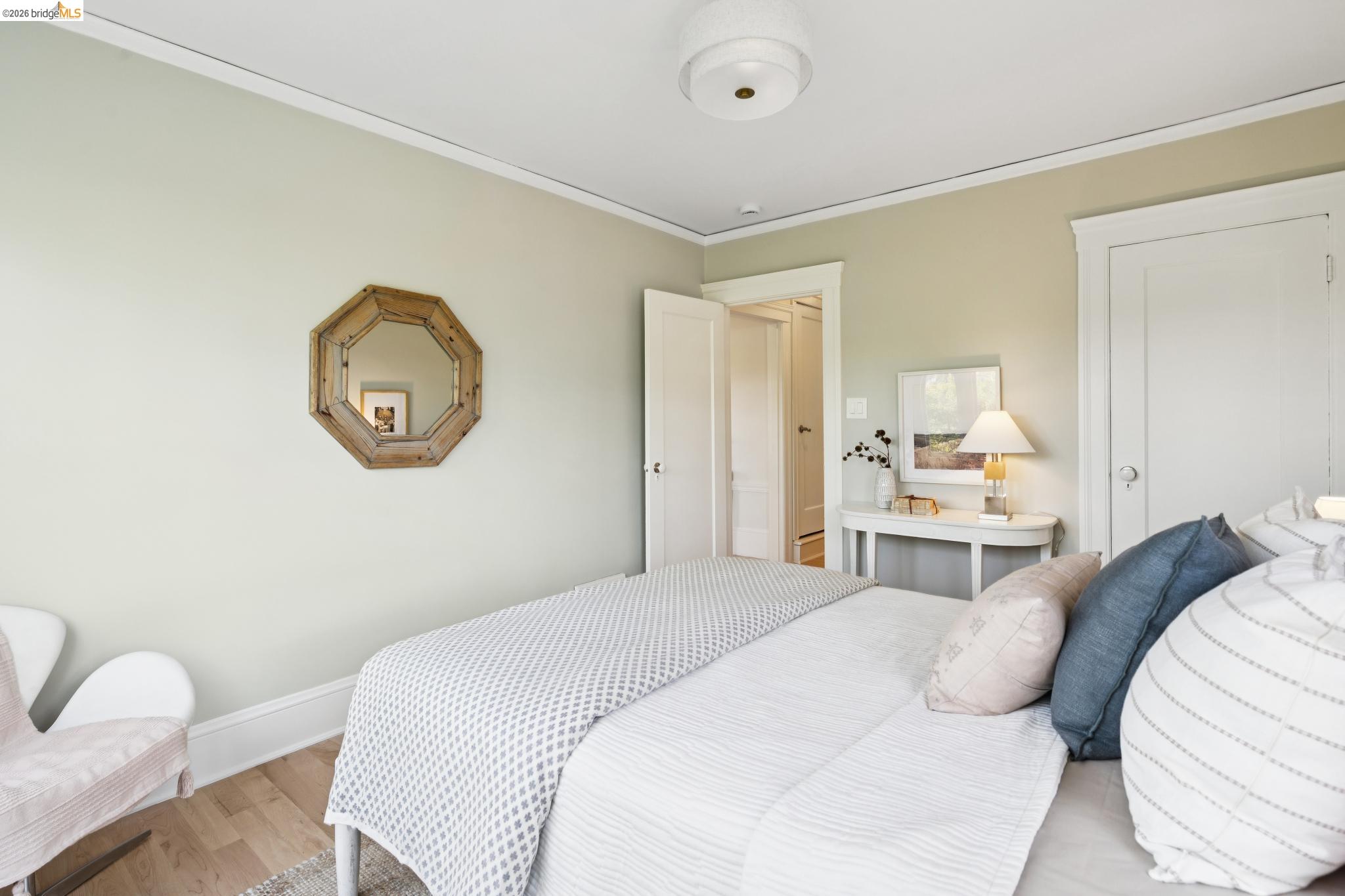 1121 Ranleigh Way Piedmont, CA 94610 - Photo 27 of 50 a bedroom with a bed large mirror and wall paintings
