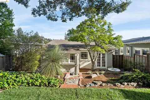front view of a house with a garden