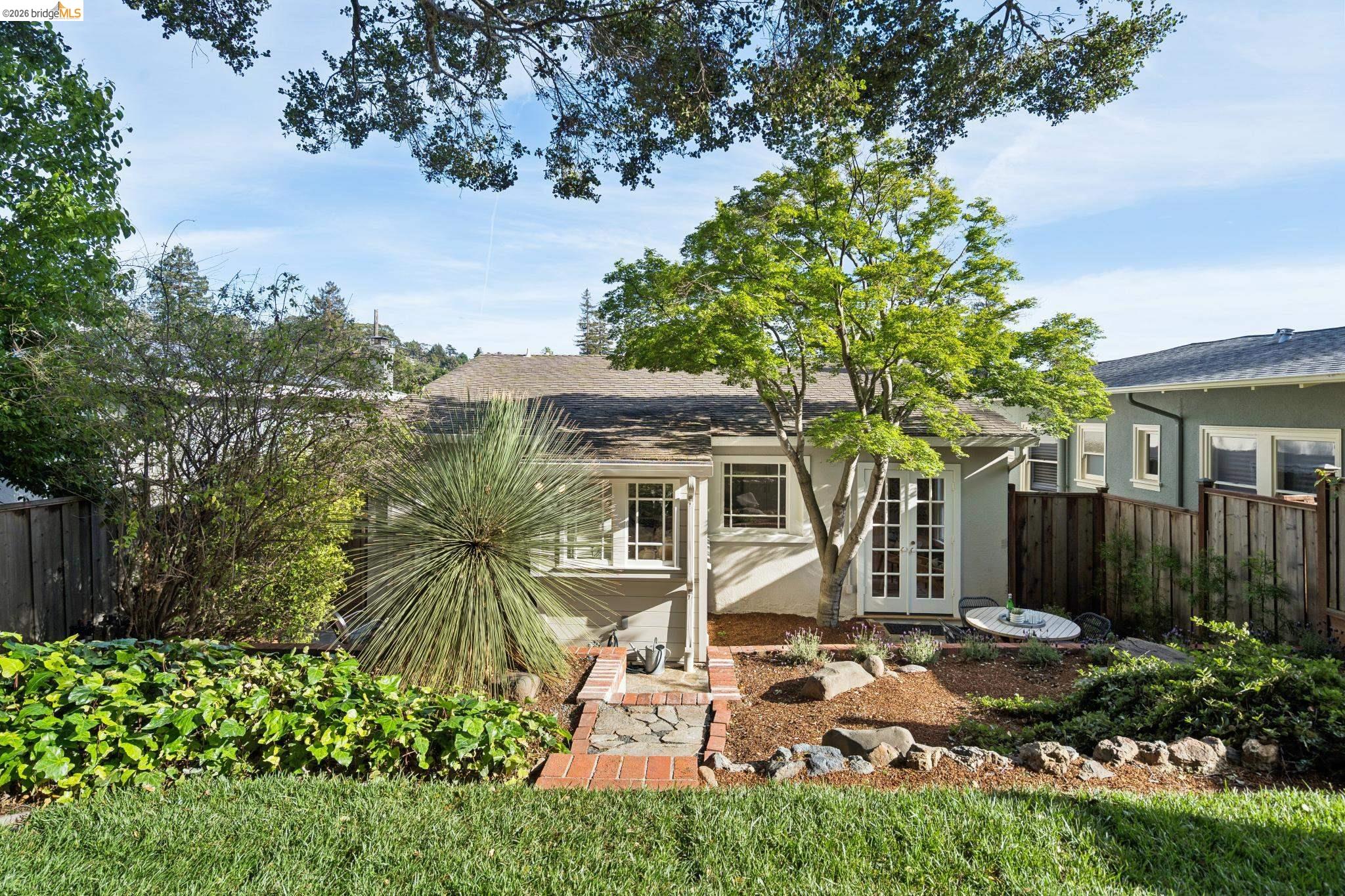 1121 Ranleigh Way Piedmont, CA 94610 - Photo 33 of 50 front view of a house with a garden