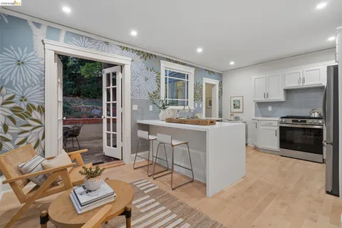 a kitchen with sink refrigerator and outdoor view
