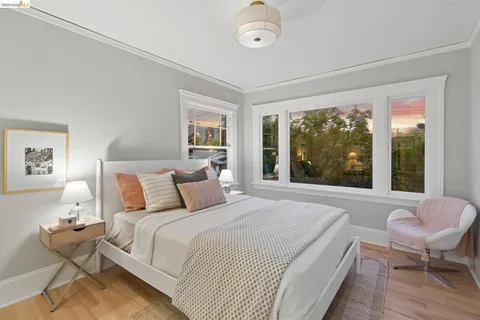 a bedroom with a bed and a chair
