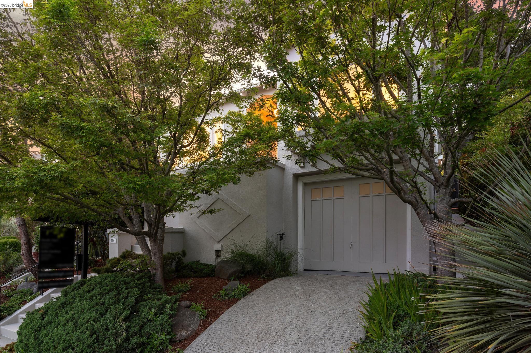 1121 Ranleigh Way Piedmont, CA 94610 - Photo 48 of 50 a front view of a house with garden