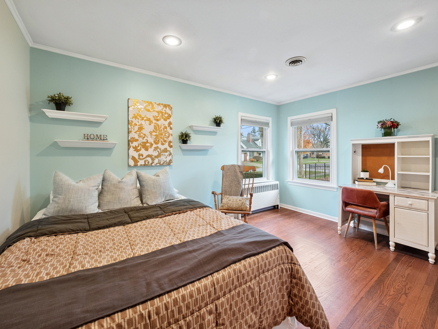 295 Ardmore Road Des Plaines, IL 60016 - Photo 12 of 30 a bedroom with a bed and a chair