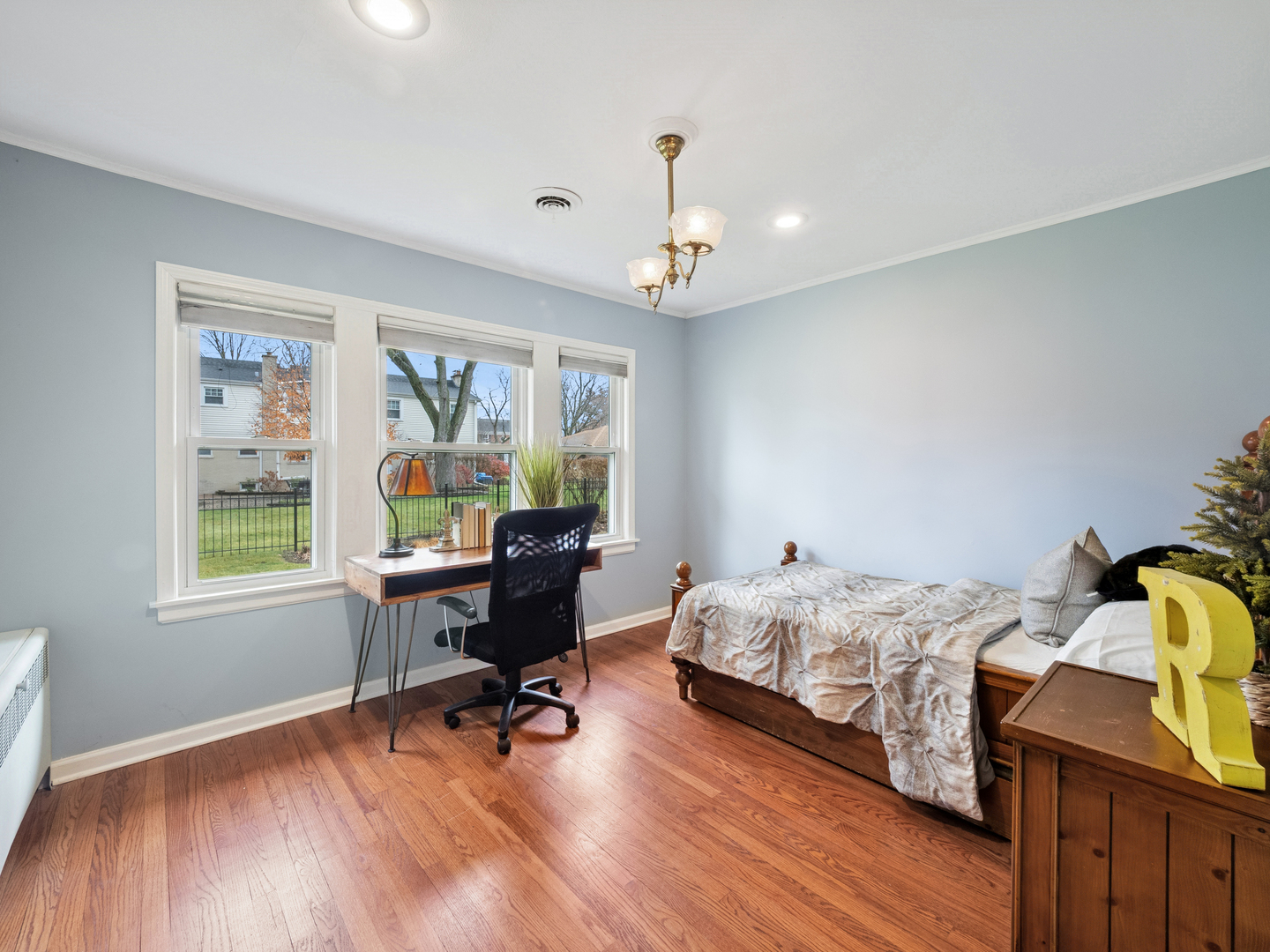 295 Ardmore Road Des Plaines, IL 60016 - Photo 13 of 30 a bedroom with a bed and wooden floor