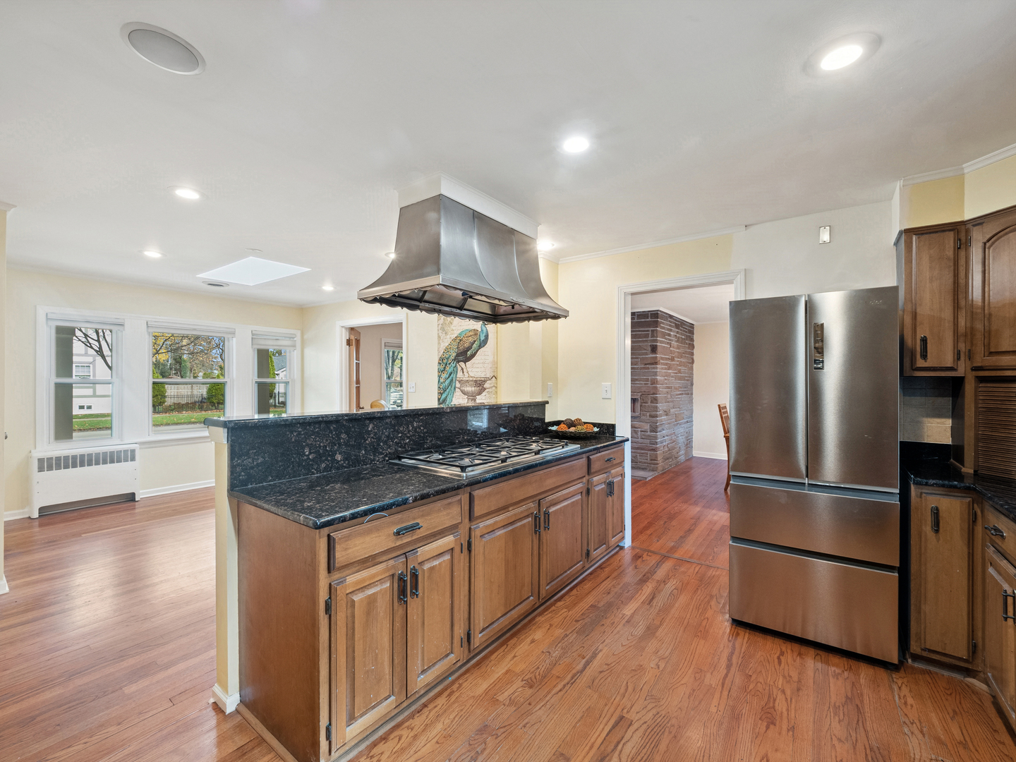 295 Ardmore Road Des Plaines, IL 60016 - Photo 10 of 30 a kitchen with stainless steel appliances granite countertop a refrigerator a stove and a wooden floors