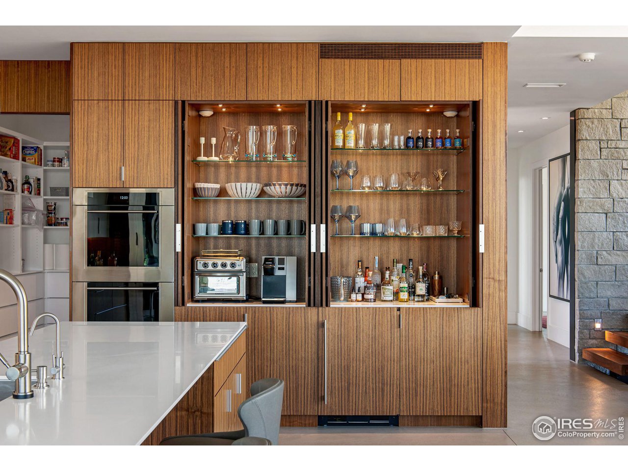 1775 Deer Valley Road Boulder, CO 80305 - Photo 12 of 40 a upper view of a kitchen with stainless steel appliances kitchen island granite countertop a refrigerator and cabinets