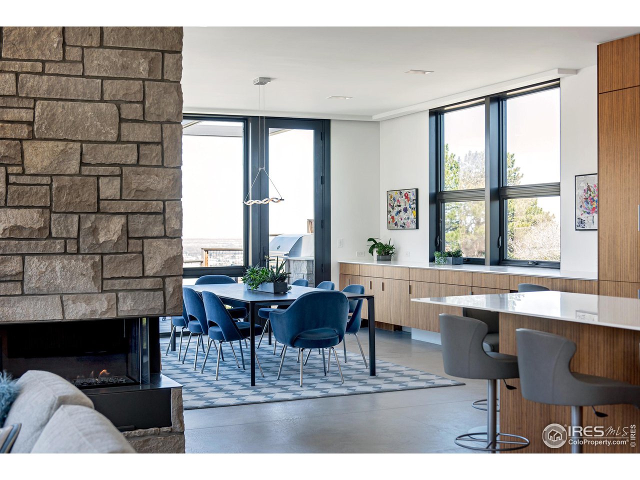 1775 Deer Valley Road Boulder, CO 80305 - Photo 14 of 40 a living room with furniture a window and a dining table