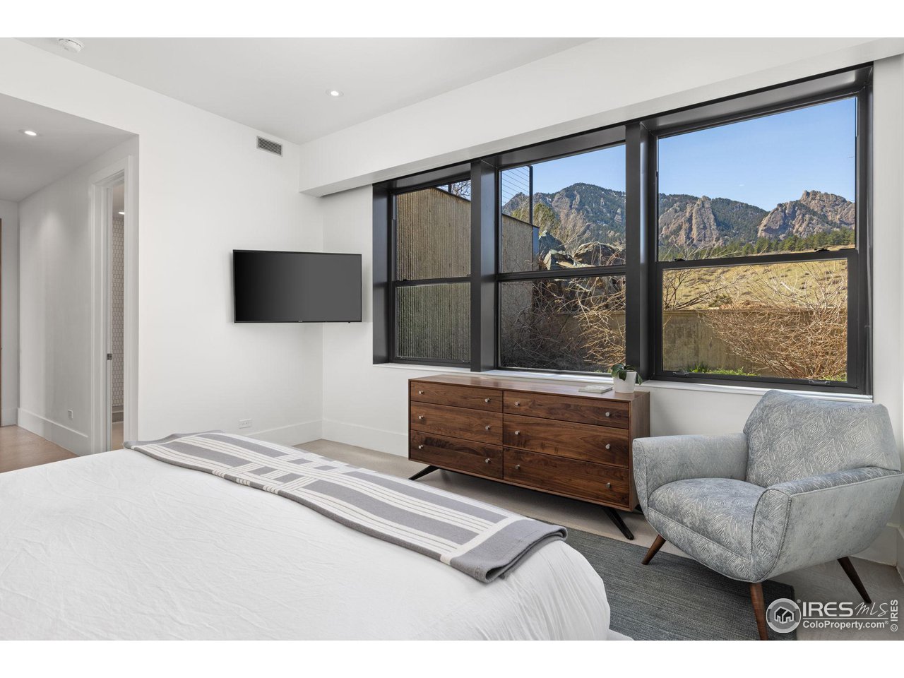 1775 Deer Valley Road Boulder, CO 80305 - Photo 34 of 40 a bedroom with furniture and a large window