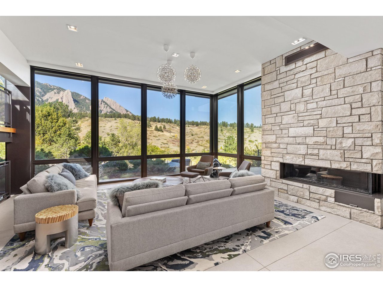 1775 Deer Valley Road Boulder, CO 80305 - Photo 5 of 40 a living room with furniture and a floor to ceiling window