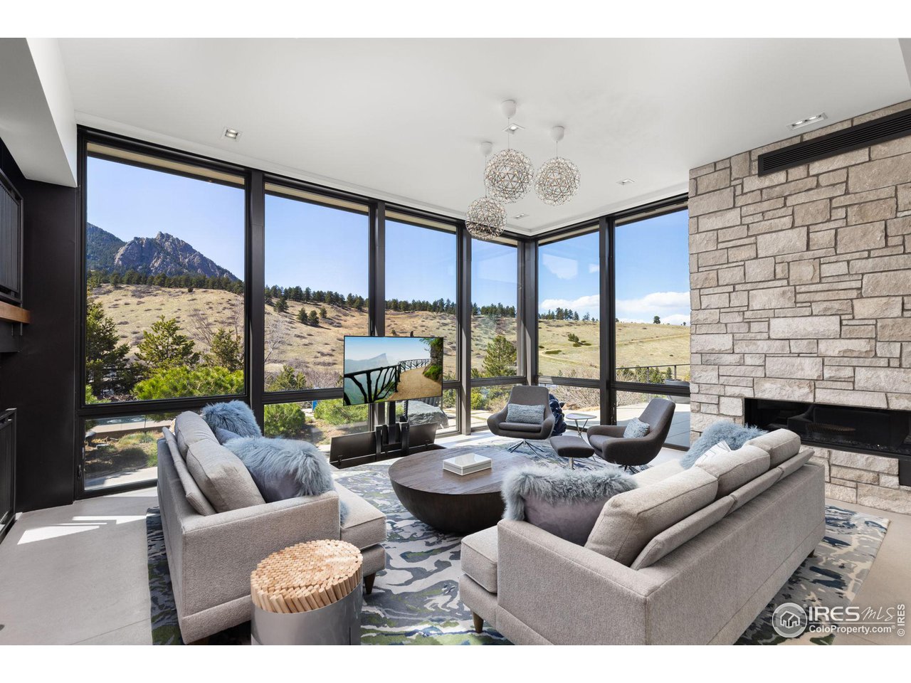 1775 Deer Valley Road Boulder, CO 80305 - Photo 7 of 40 a living room with furniture and large windows